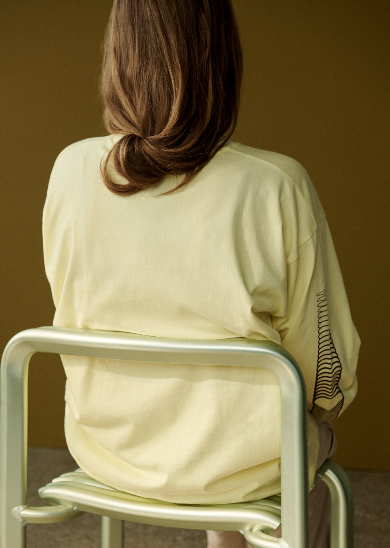 /cdn-cgi/image/width=1500,quality=85,format=auto/globalassets/content-media/images/20-year-and-3days/close-to-heart/next-chapters-close-to-heart-chair-longsleeve-tee-yellow-low-res.jpg