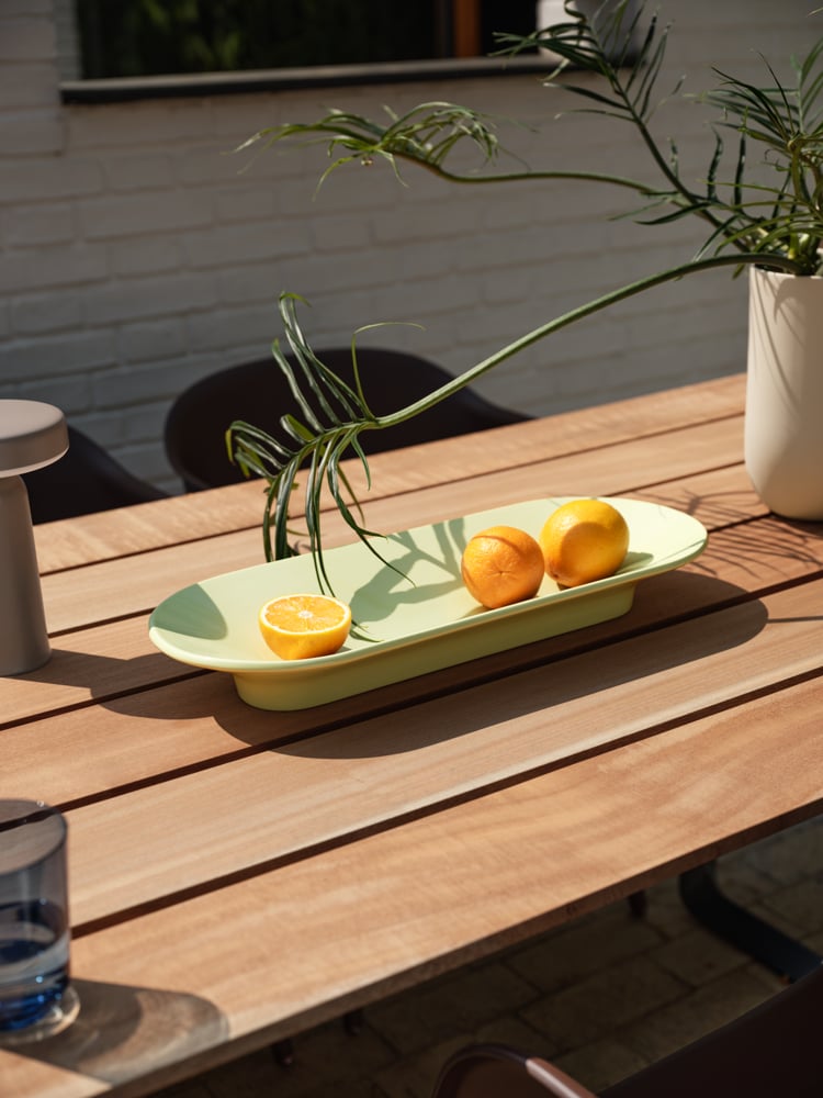 /cdn-cgi/image/width=1500,quality=85,format=auto/globalassets/content-media/images/plp/outdoor/accessories/mere-bowl-light-green-70-70-outdoor-table-sapele-mahogany-fiber-outdoor-armchair-brown-green-ease-taupe-kink-muuto-org.png