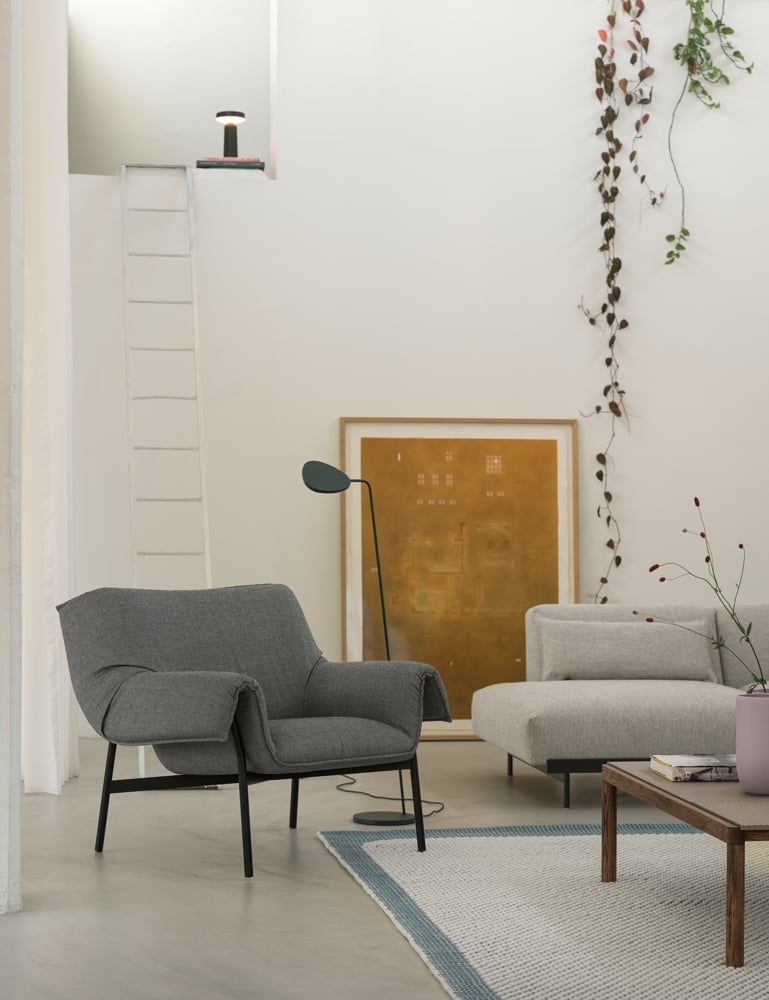 /cdn-cgi/image/width=1500,quality=85,format=auto/globalassets/content-media/images/plp/sofas/lounge-chairs/wrap-lounge-chair-sabi-151-black-in-situ-clay-12-pebble-rug-pale-blue-couple-120x84x35-2-plain-1-wavy-taupe-dark-oiled-aok-ease-black-leaf-floor-dark-green-muuto-org.png