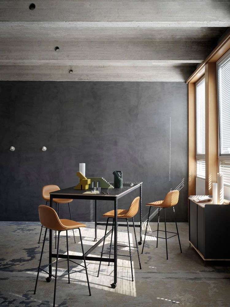 /cdn-cgi/image/width=1500,quality=85,format=auto/globalassets/content-media/images/products/shop-by-family/fiber-chair-family/slider/base-high-table-w-castors-black-plywood-190-85-105-fiber-bar-stool-75-tube-base-cognac-black-enfold-tip-wall-lamp-muuto-med-res.jpg