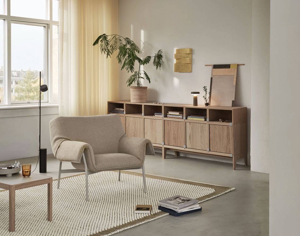 /globalassets/content-media/images/about/our-story-a-space-that-just-feels-right/wrap-lounge-chair-ecriture-240-grey-workshop-coffee-table-warm-grey-linoleum-pebble-rug-200x300-brown-green-post-raise-stacked-ease-taupe-muuto-org.jpg?revision=639064866880000000