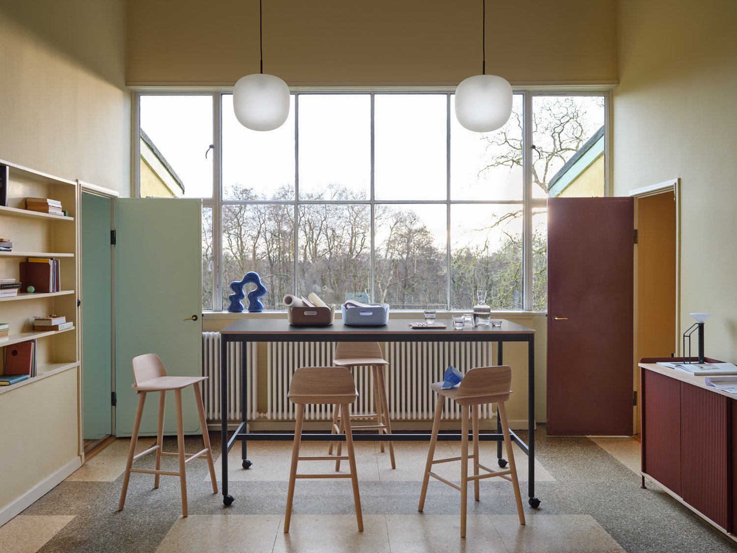 Base High Table w. Castors 190x85 cm H105 in Black - Nerd Bar Chair in Oak - Enfold Sideboard 148x45 cm H85 in Deep Red - Rime Pendant Ø37 cm in Deep Red - Restore Tray in Brown Green and Light Blue - Raise Carafe & Glasses in Clear - Piton Portable Lamp in Black - Compile Bookend in Deep Red Base High Table w. Castors 190x85 cm H105 in Black - Nerd Bar Chair in Oak - Enfold Sideboard 148x45 cm H85 in Deep Red - Rime Pendant Ø37 cm in Deep Red - Restore Tray in Brown Green and Light Blue - Raise Carafe & Glasses in Clear - Piton Portable Lamp in Black - Compile Bookend in Deep Red