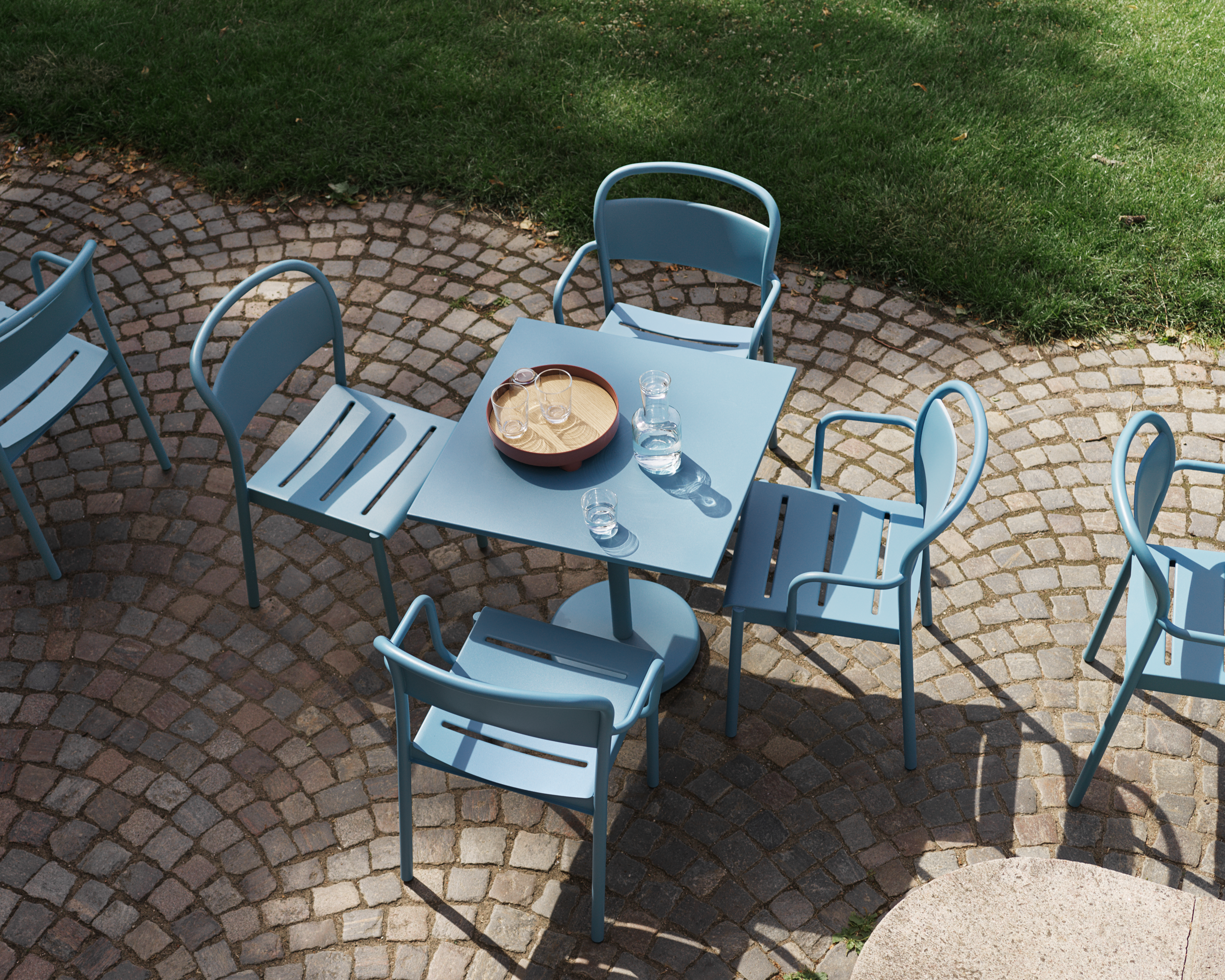 Linear Steel Café Table H:73 cm 70x70 cm in Pale Blue - Linear Steel Side Chair in Pale Blue - Linear Steel Armchair i Pale Blue - Raise Carafe & Glasses in Clear - Platform Tray