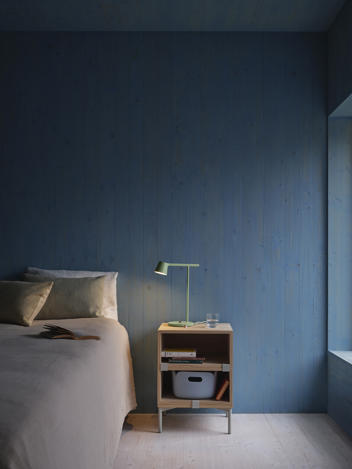 A Stacked Bed Side Table in Oak styled with a Tip Table Lamp in light green. Creating a cozy atmosphere for any modern bedrooms. 