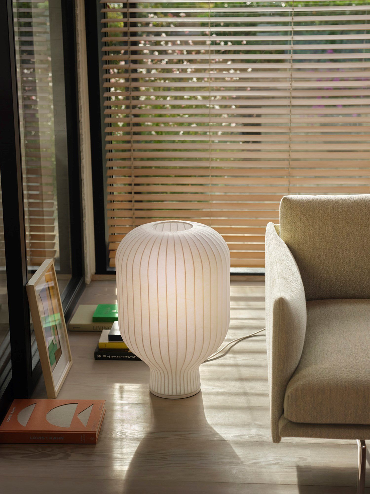 The sculptural form with soft curves understates the feeling of a pleasant light. The Strand Table Lamp H59 size is in between a floor and table lamp, which ensure a very versatile use for several different contexts.  The sculptural form with soft curves understates the feeling of a pleasant light. The Strand Table Lamp H59 size is in between a floor and table lamp, which ensure a very versatile use for several different contexts.