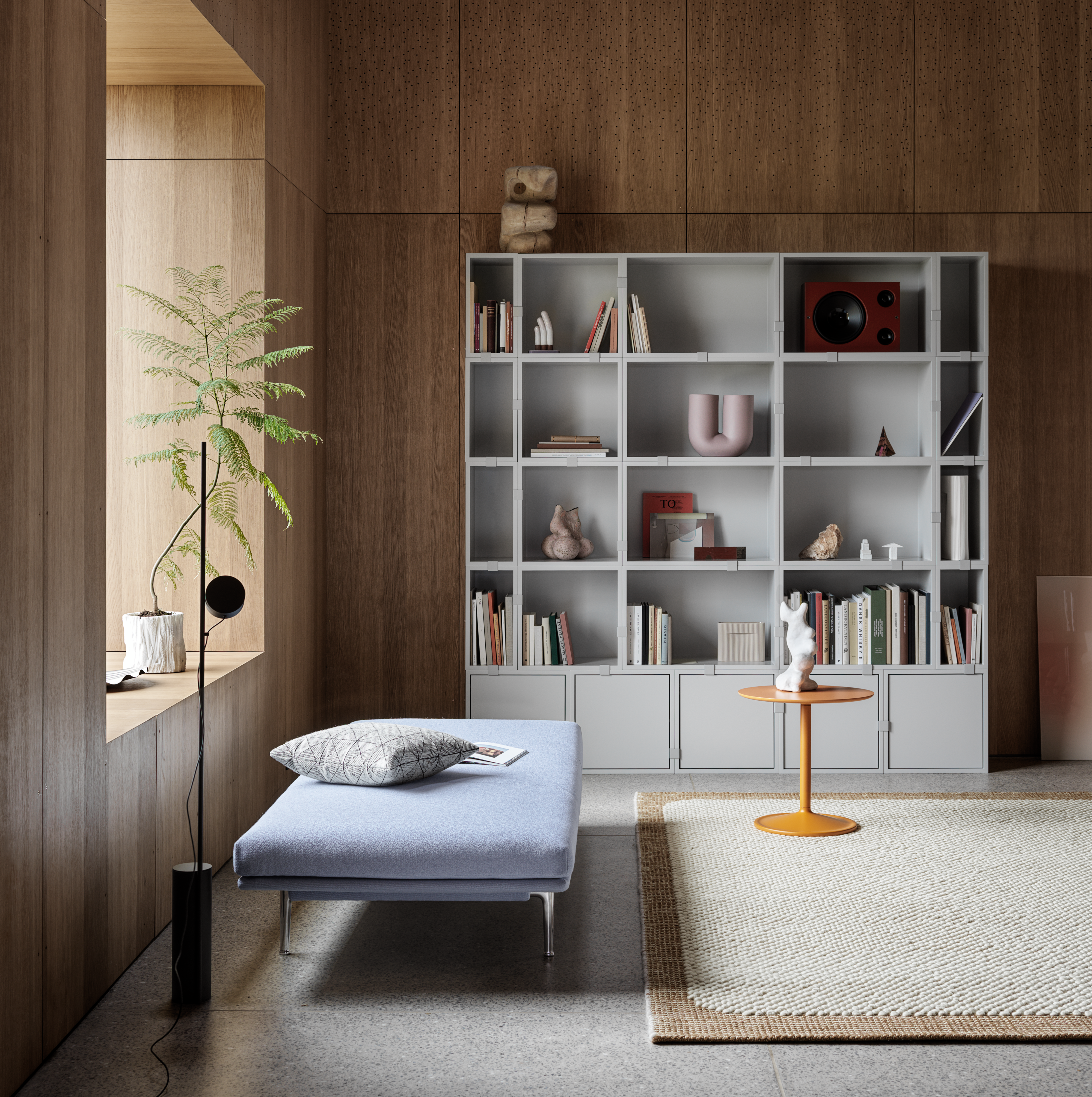 Stacked Storage System in Grey - Outline Daybed in Vidar 723 - Soft Side Table in Orange Ø48 H48 - Pebble Rug in Burnt Orange - Kink Vase in Dusty Lilac