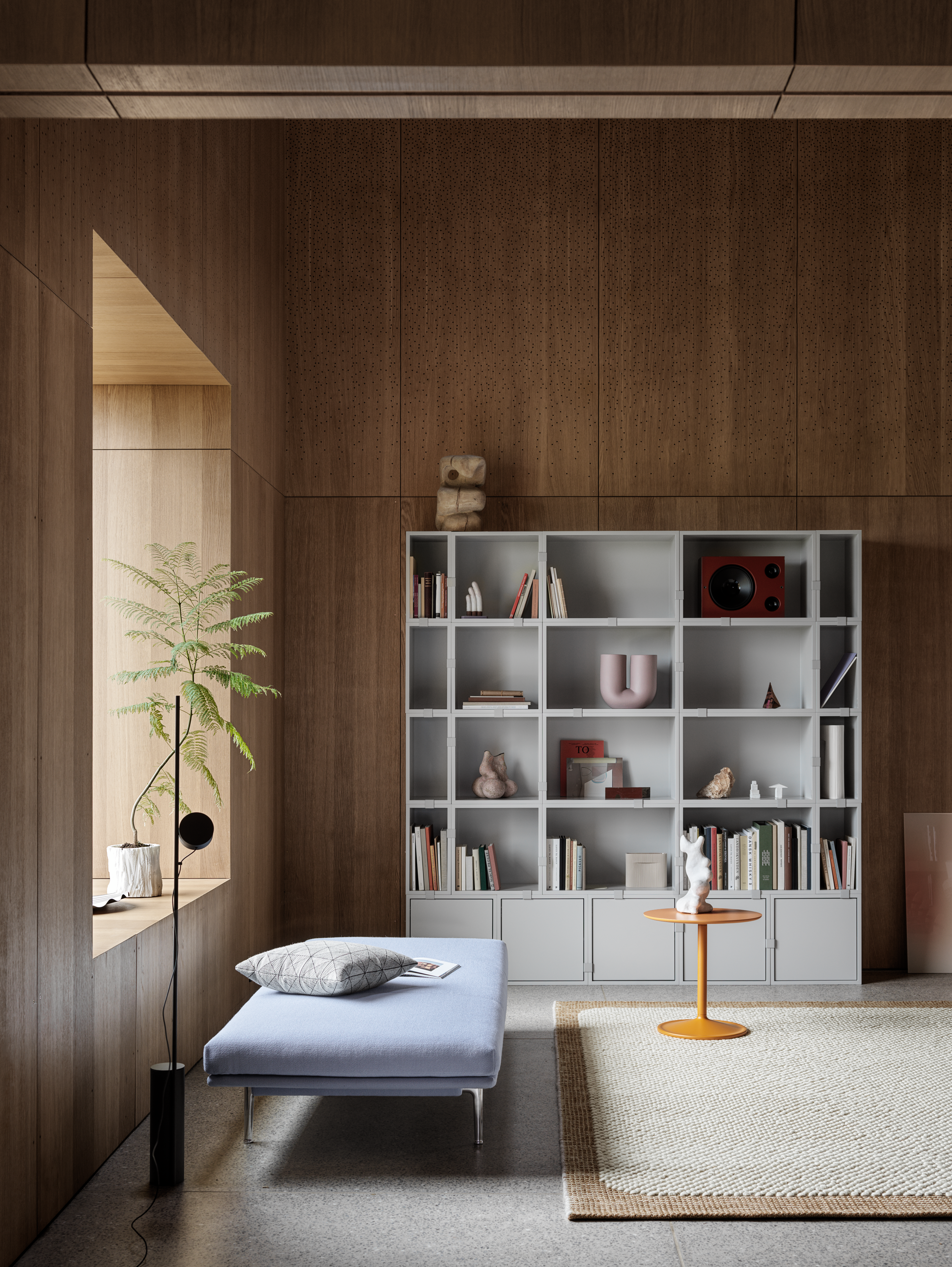 Interior setting featuring Stacked Storage System in Grey,  Outline Daybed in Vidar 723, Soft Side Table in Orange Ø48 H48, Pebble Rug in Burnt Orange and Kink Vase in Dusty Lilac. A colourful and contemporary composition by Muuto.