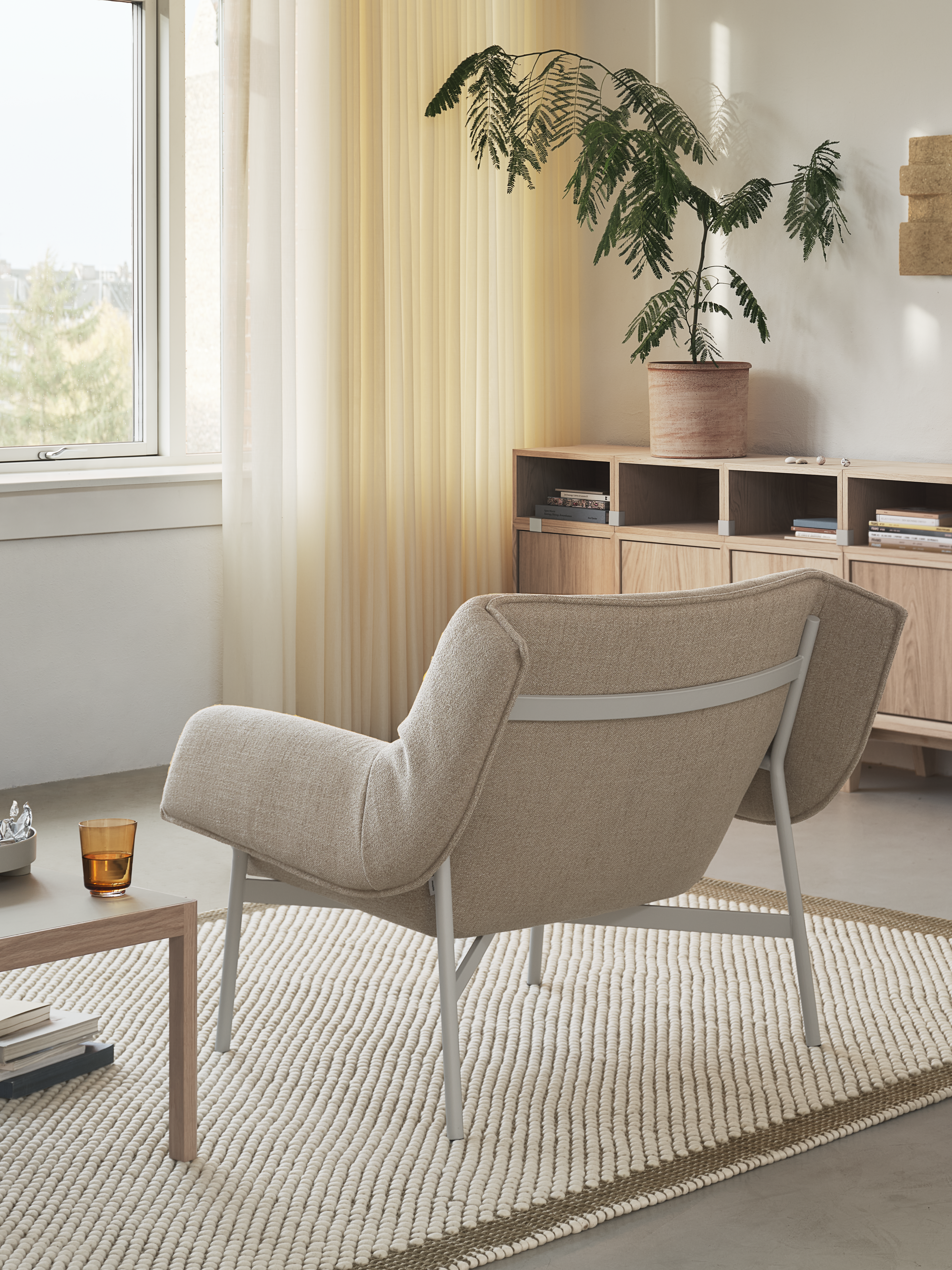 Wrap Lounge Chair in Ecriture 240/Grey, Workshop Coffee Table in Warm Grey Linoleum/Oak, Raise Glass in Burnt Orange, Pebble Rug in Brown Green 170x240 cm, Stacked Storage System in Oak