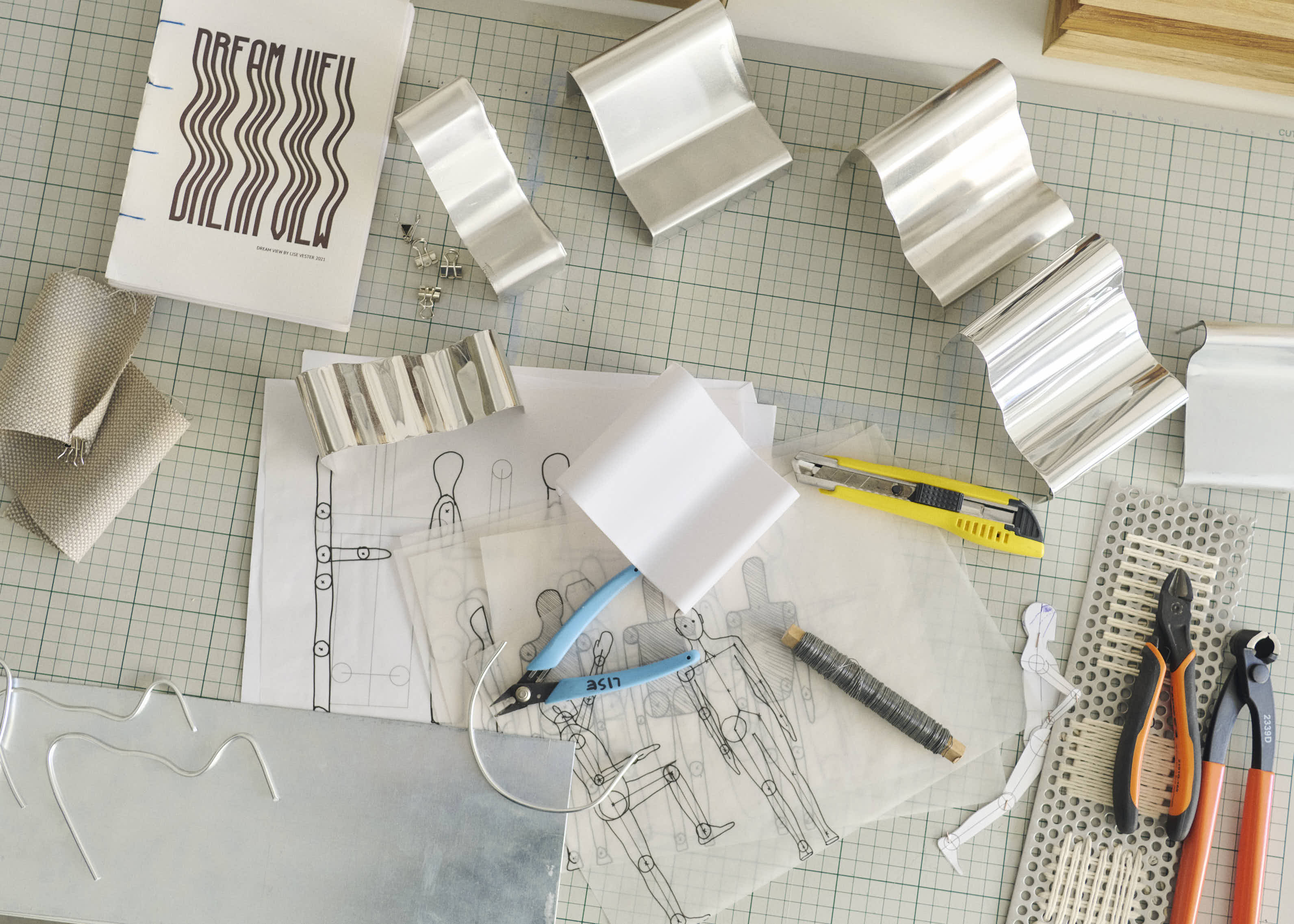 A moment from Lise Vester’s design process, showing sketches and models in the studio, offering insight into the development of form and function through hands-on exploration.