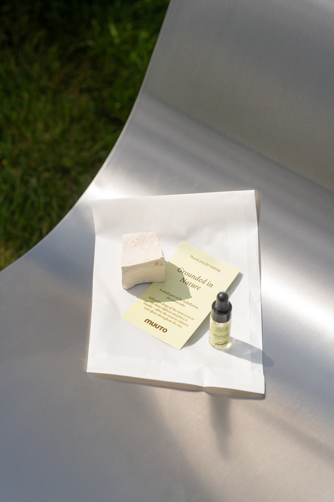 A small bottle with Muuto's own scent placed on a Dream View Chair