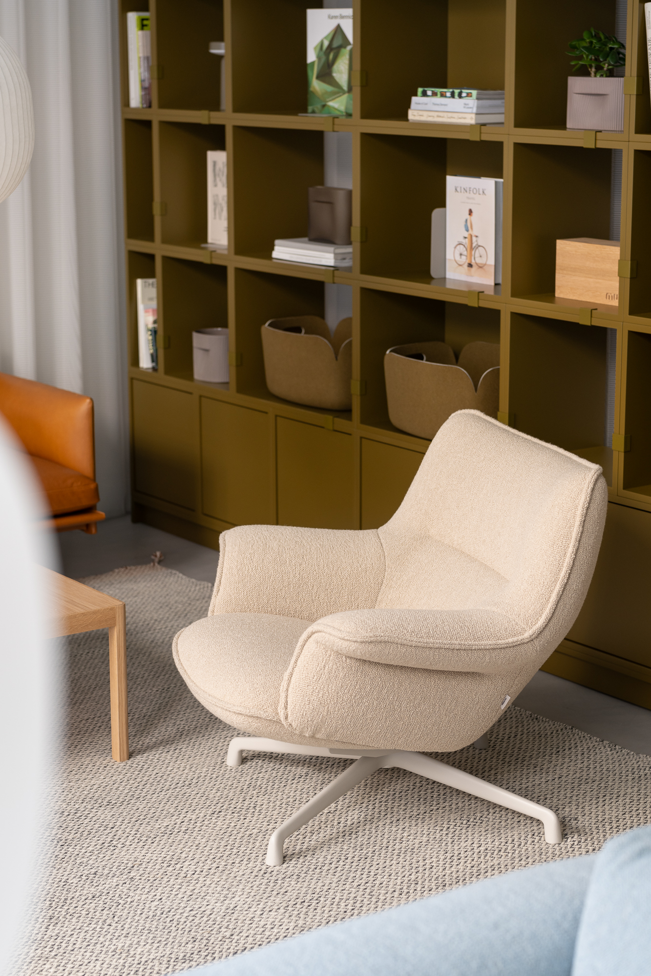 A close up of a Lounge chair in a light sand color.