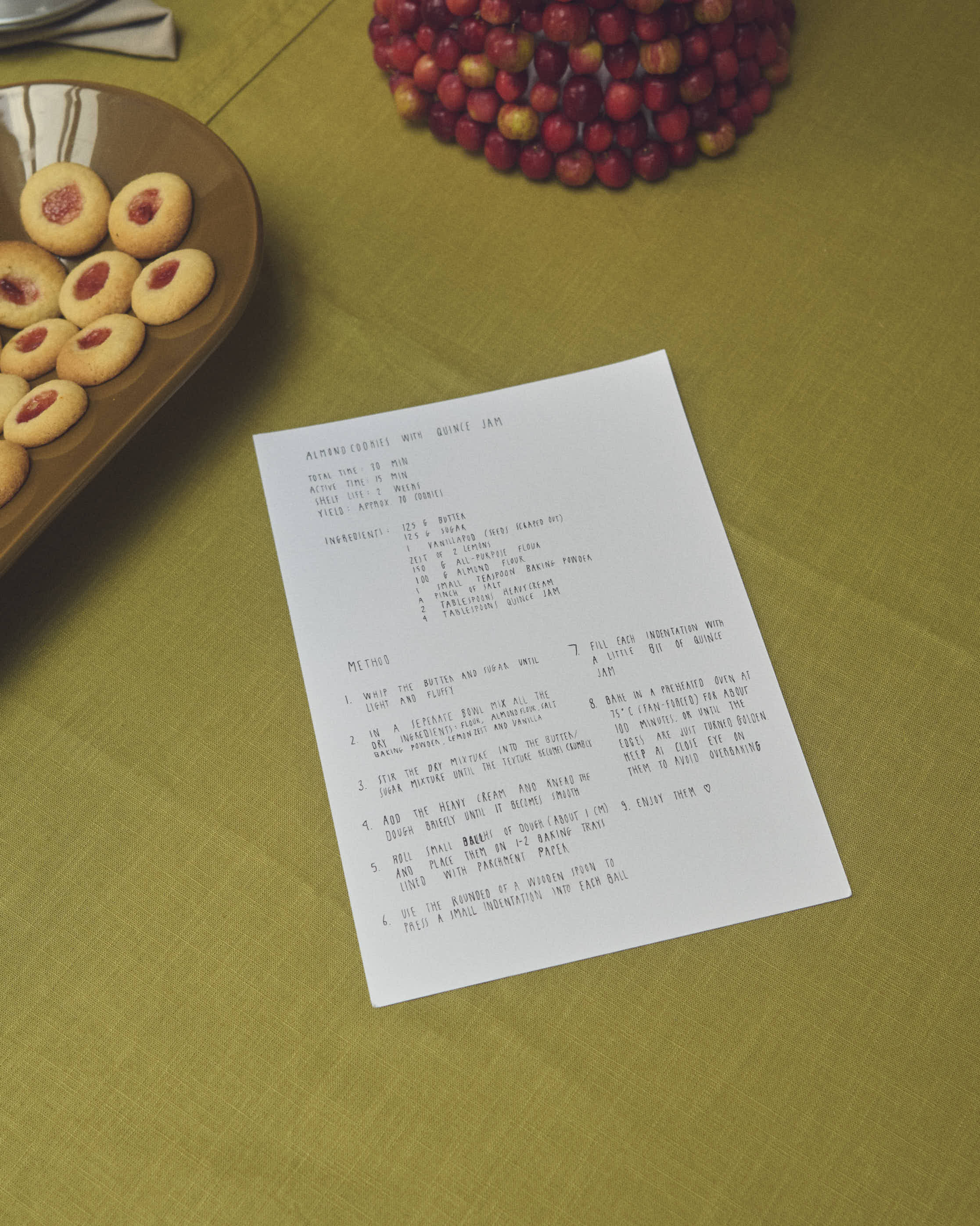 Holiday moment featuring a recipe for almond cookies presented with the Muuto Mere Bowl, styled in a warm and inviting setting with seasonal details.