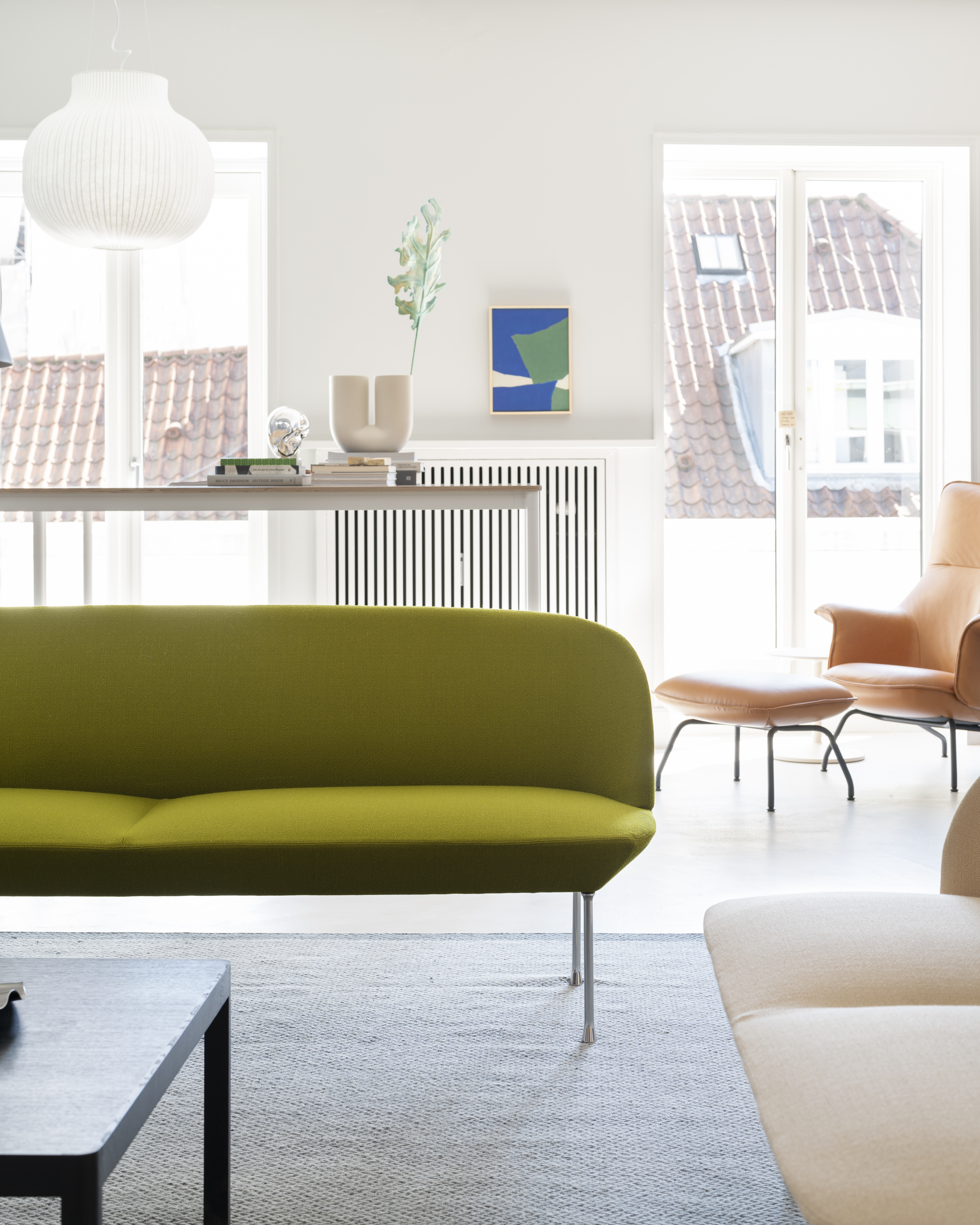 Muuto HQ showroom, showcasing a curated interior with contemporary furniture and lighting in a modern, open setting.