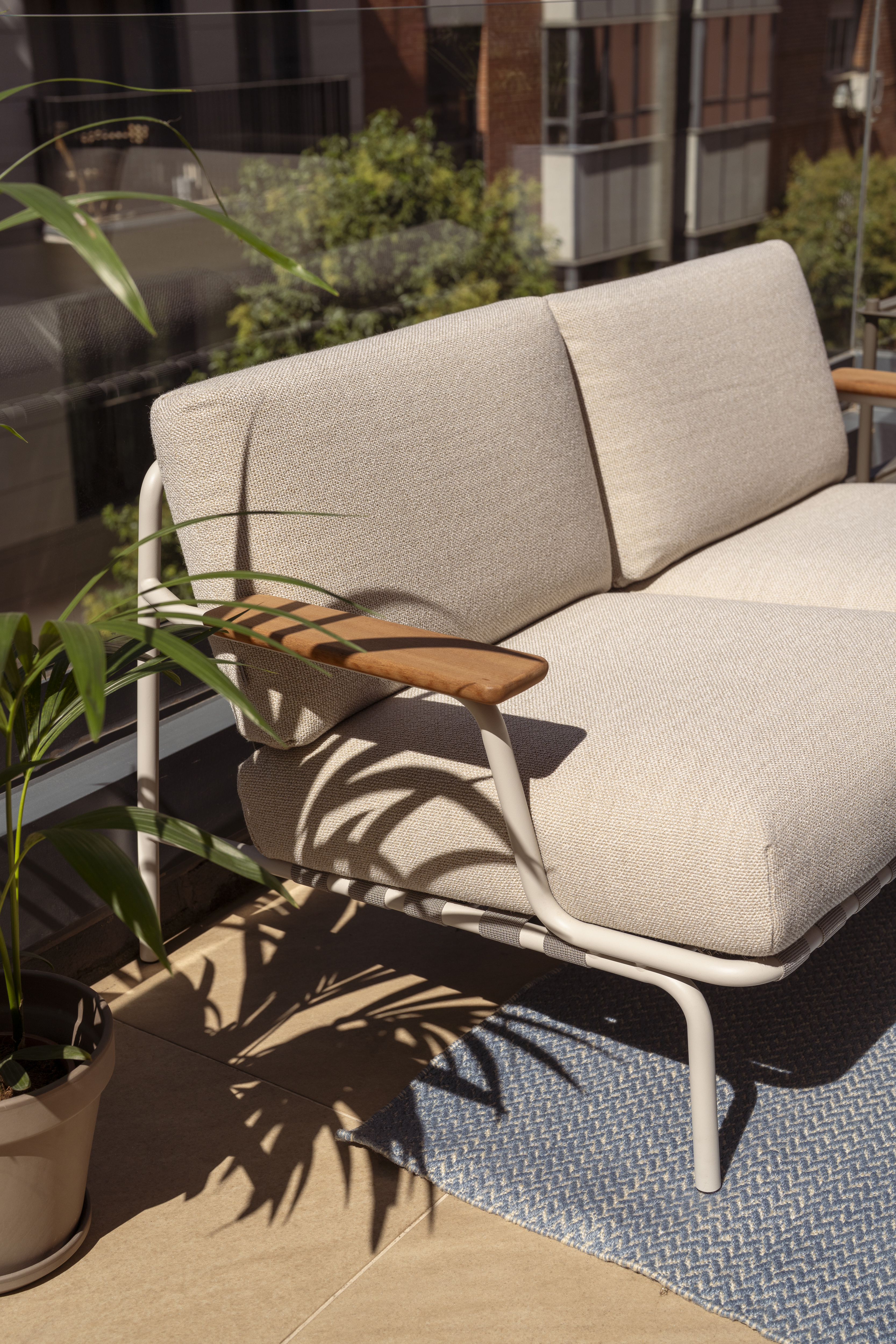 Outdoor setting from the Muuto showroom in Madrid featuring the Settle Sofa, styled in a clean and contemporary space.