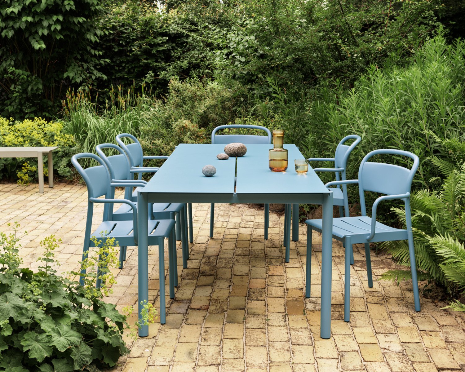 Linear Steel Table 220x90 cm in Pale Blue - Linear Steel Armchair Pale Blue - Raise Carafe & Glass in Burnt Orange